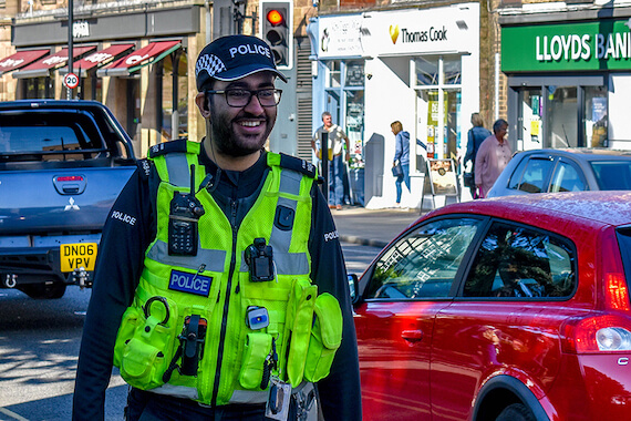 Derbyshire Constabulary Jobs | Careers Website | Asian Male Police Officer in Town Centre Image.jpg