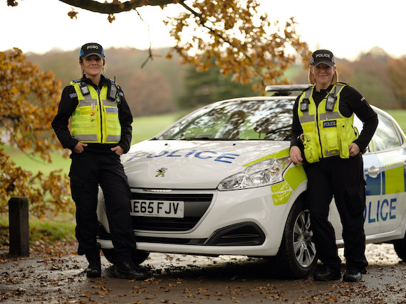 Derbyshire Constabulary Jobs | Careers Website | Two White Female Police Officers in Front of Police Car Image.jpg