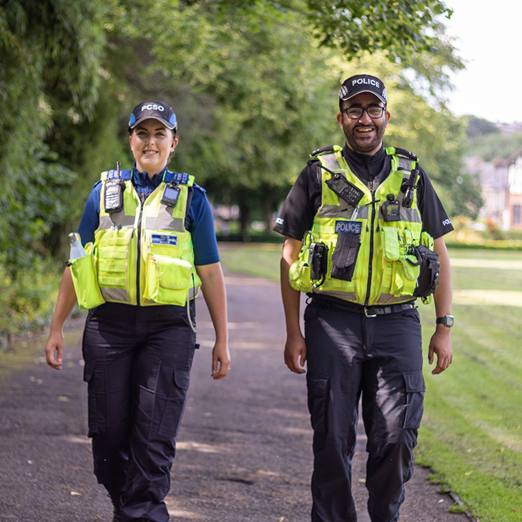An PC and PCSO walking in a public park.jpg